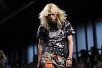 Blonde hair Asian man dressed up in camo pants and black tshirt fashion runway adult.