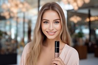 A girl take a selfie with video recording in front cosmetics lipstick perfection.