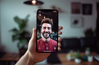 Smart phone screen with smiling influencer making vlog at home photography selfie photographing.