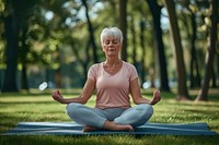 Woman in sporty outfit relaxing sports meditating zen-like.