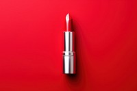 Lipstick cosmetics red red background.