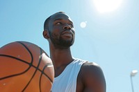 Black man holding basketball outdoors sports adult.