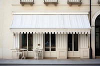 White shop Awning over cafe windows awning furniture outdoors.