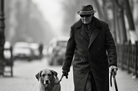 A blind man with guide dog walking overcoat portrait.