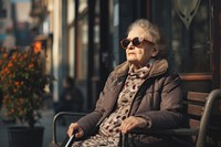 A blind woman glasses sitting adult.