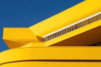Photo of modern architecture yellow building outdoors.