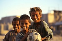 Boys play football sports child smile.