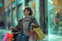 A smart looking mature woman on wheelchair with shopping bags sitting handbag adult.