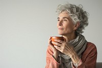 Mature woman in tea time portrait coffee photo.