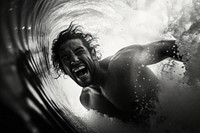 Surfing a wave photography swimming laughing.