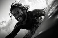Surfing a wave photography portrait outdoors.