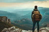 Lonely traveler man with bagpack backpacking landscape mountain.