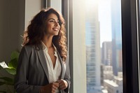 Business woman standing smiling window.