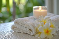 Spa towel white candle with frangipani relaxation freshness fragility.