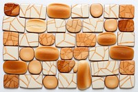Mosaic tiles of biscuits backgrounds shape food.