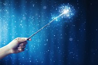 Magic wand with sparkle holding sparks light.