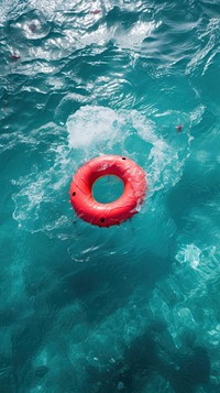 Red inflatable ring in the ocean outdoors nature underwater.
