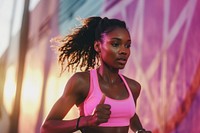 Black female athlete is running adult determination exercising.