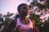 Black female athlete is running jogging determination athleticism.
