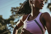 Black female athlete is running adult determination athleticism.