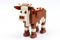 Cow bricks toy white background representation livestock.