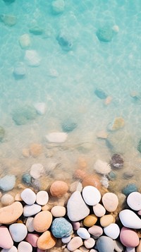 Pastel beach rocks under clear outdoors pebble nature.