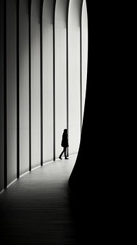 Photography of people walking architecture silhouette tunnel.