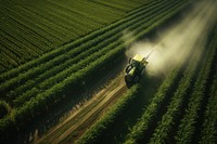 Spraying fertilizer outdoors tractor nature.