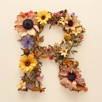 Alphabet R font flower wreath plant.