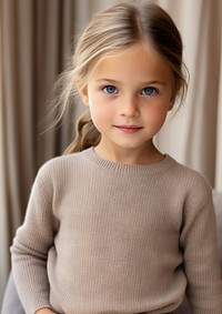 Kid wearing knit cashmere kid dress sweater child hairstyle.