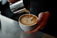 Coffee barista making drink.