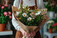Woman hand packing flower bouquet plant daisy adult.