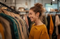 Woman checking clothes stock adult smile happy.
