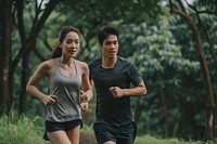 Couple wearing sportwear running together jogging sports shorts.