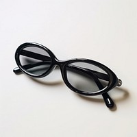 Small slim oval black sunglasses white background accessories simplicity.