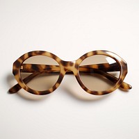 Small slim oval walnut tortoise sunglasses white background accessories accessory.