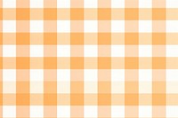 Light orange gingham pattern backgrounds tablecloth.