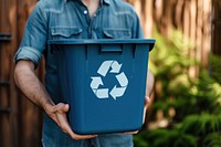 Man holding recycle bin adult container recycling.