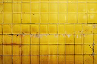 Yellow backgrounds tile wall.