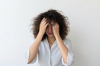 Woman doing facepalm anxiety worried pain.