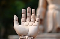 Buddha statue hand finger representation.