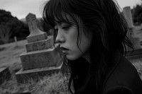 JapaneseYoung female crying at the grave portrait outdoors adult.