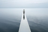 Man walking on the sea split outdoors standing horizon.