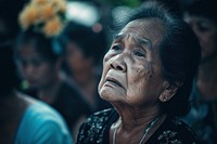 Thai people crying at the Thai grave adult sad contemplation.