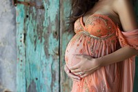 Pregnant woman adult dress anticipation.