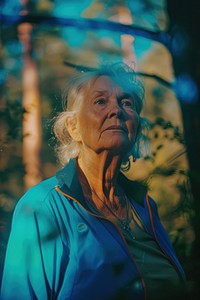 Old woman wearing blue streetwear clothes portrait adult photo.