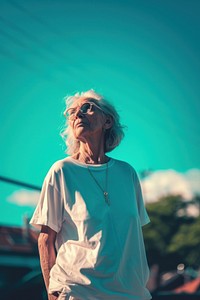 Old woman wearing white streetwear clothes glasses adult architecture.