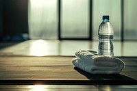 Water bottle and white towel refreshment relaxation flooring.