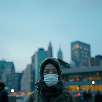 Woman wearing face mask portrait city photography.