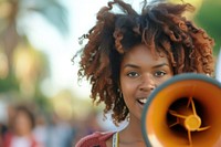 Young african american woman using megaphone portrait photo girl.